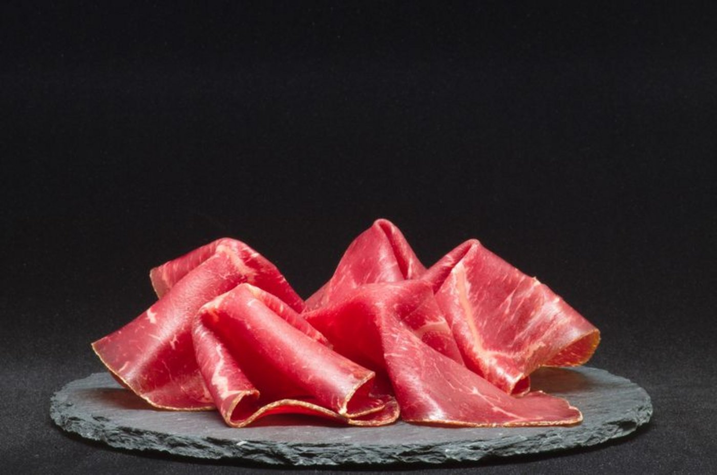 Trockenfleisch Zum Bündnerfleisch und zum Tête de Moine stossen jetzt «Jambon cru du Valais», «Lard sec du Valais» und die «Zuger Kirschtorte» als geschützte geografische Angaben dazu. (Symbolbild Pixabay)